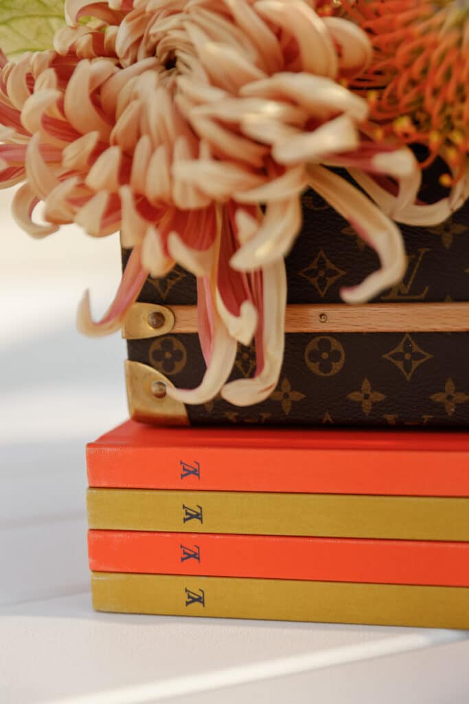 Editorial photography of Louis Vuitton accessories and books at Casa Fuster in Barcelona. Photo by Santa Cruz Juanjo Vega, photographer of exclusive design and fashion events in Barcelona.